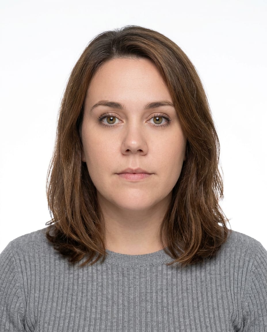 The same person as a compliant passport photo on a plain white background